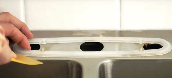 How To Remove Kitchen Faucet Without Basin Wrench In 3 Easy Steps? 6 Use A Putty Knife To Gently Work It Loose