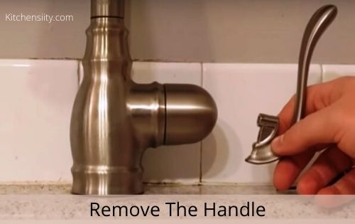 Tighten A Loose Moen Single-Handle Kitchen Faucet In 3 Easy Steps 4 Remove the faucet handle