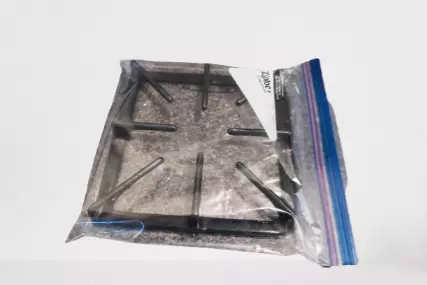 Stove Grates Soaking In Ammonia Solution In A Plastic Bag